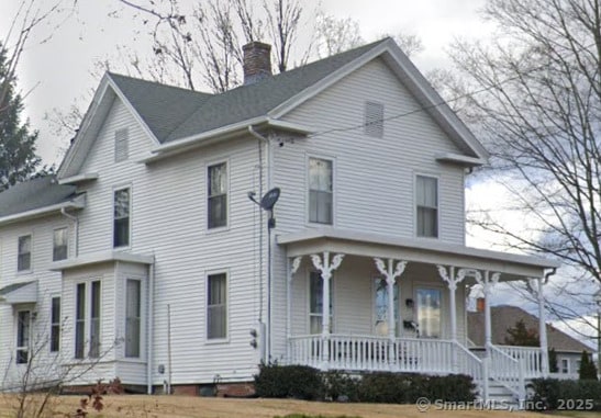 120 S Main St, Manchester, CT 06040 - view of front of house featuring a porch and a chimney