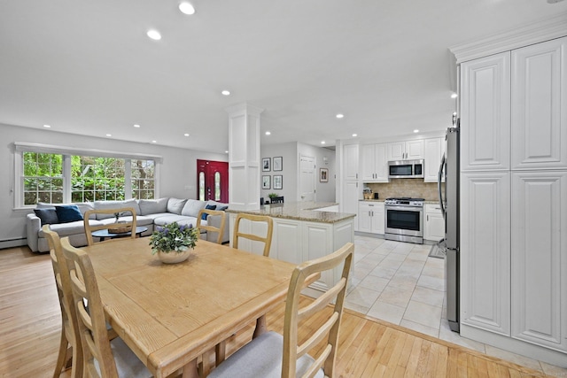 10 Eric Ct, Norwalk, CT 06851 - dining space with recessed lighting and light wood-style flooring