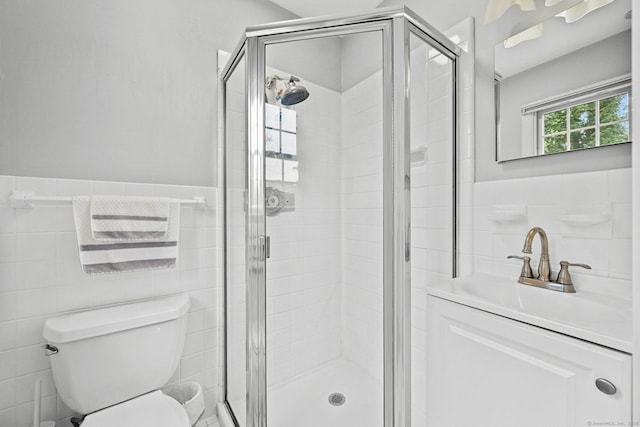 10 Eric Ct, Norwalk, CT 06851 - full bathroom with tile walls, a shower stall, vanity, and a wainscoted wall
