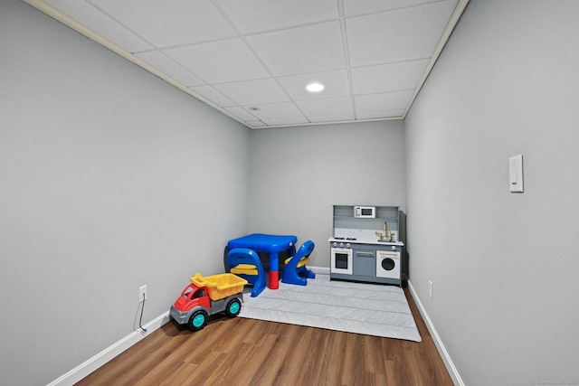 10 Eric Ct, Norwalk, CT 06851 - recreation room featuring wood finished floors, a paneled ceiling, and recessed lighting