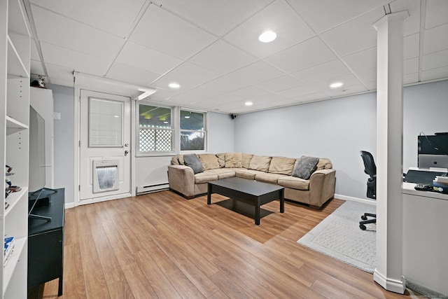 10 Eric Ct, Norwalk, CT 06851 - living room with light wood finished floors, baseboard heating, a drop ceiling, and recessed lighting