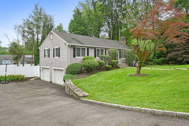 10 Eric Ct, Norwalk, CT 06851 - view of front of house with an attached garage, driveway, a chimney, and roof with shingles