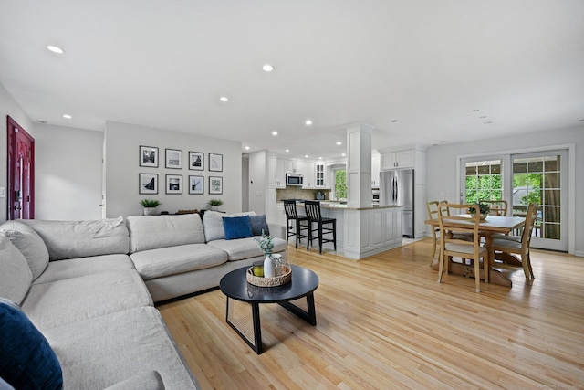 10 Eric Ct, Norwalk, CT 06851 - living area with recessed lighting, light wood-type flooring, and decorative columns