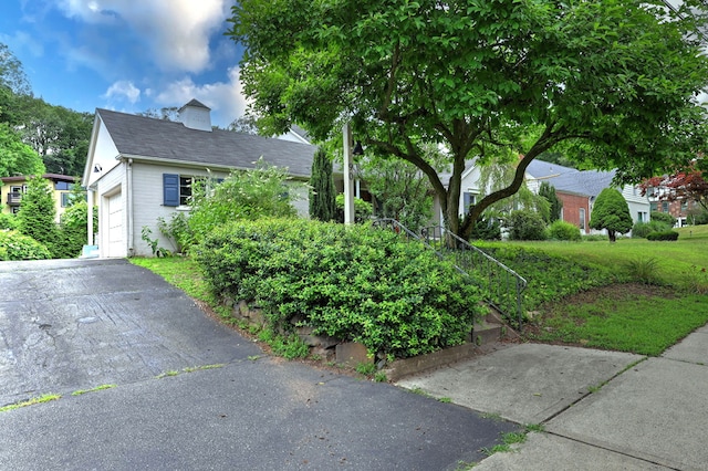 90 Edgewood Way, New Haven, CT 06515 - view of front of property with a garage, a chimney, driveway, and brick siding
