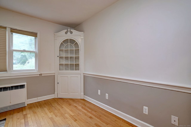 90 Edgewood Way, New Haven, CT 06515 - unfurnished dining area featuring radiator heating unit and hardwood / wood-style floors