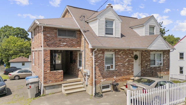 52 Colony St, Bristol, CT 06010 - townhome / multi-family property featuring brick siding, a shingled roof, and cooling unit