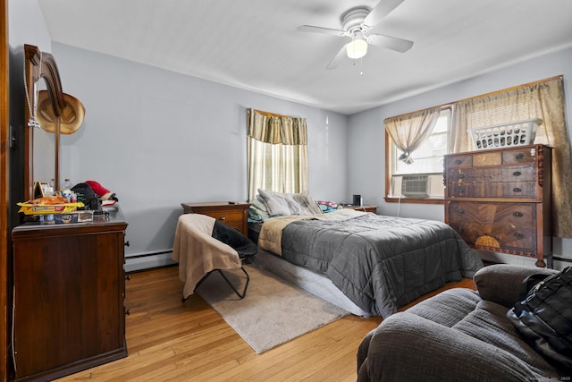 52 Colony St, Bristol, CT 06010 - bedroom with baseboard heating, light wood finished floors, ceiling fan, and cooling unit