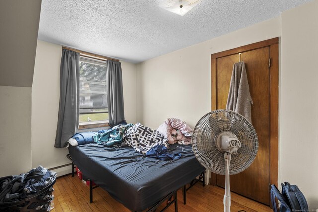 52 Colony St, Bristol, CT 06010 - sitting room with hardwood / wood-style flooring and a textured ceiling