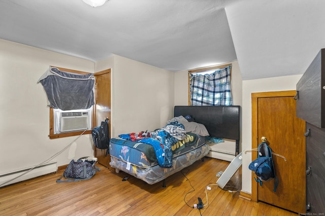 52 Colony St, Bristol, CT 06010 - bedroom featuring hardwood / wood-style flooring, cooling unit, and a baseboard heating unit