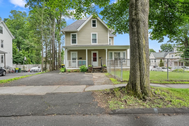 17 Pleasant St, Danbury, CT 06810 - view of front facade featuring a porch and asphalt driveway