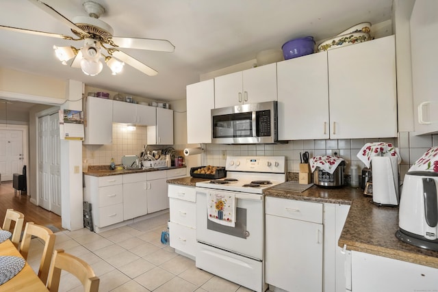 17 Pleasant St, Danbury, CT 06810 - kitchen featuring electric stove, stainless steel microwave, dark countertops, tasteful backsplash, and ceiling fan
