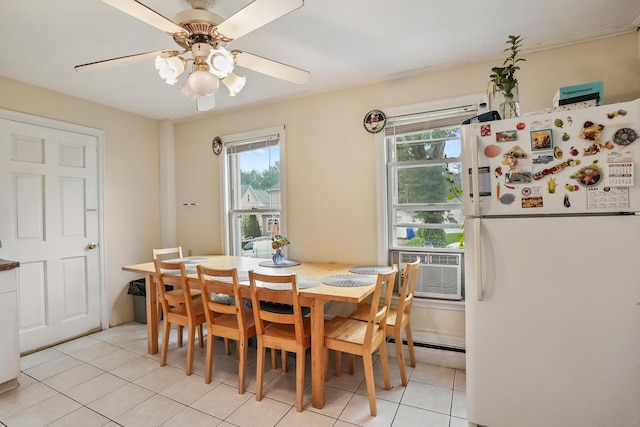 17 Pleasant St, Danbury, CT 06810 - dining space with light tile patterned flooring, a ceiling fan, and a baseboard heating unit