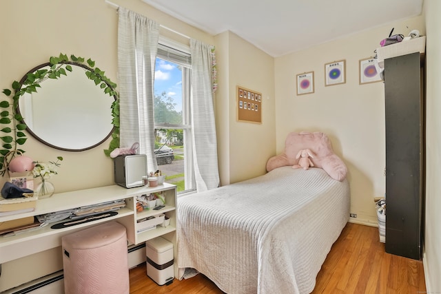 17 Pleasant St, Danbury, CT 06810 - bedroom with light wood finished floors, a desk, and baseboard heating