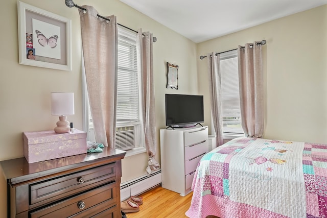 17 Pleasant St, Danbury, CT 06810 - bedroom with a baseboard radiator, light wood-style floors, and cooling unit
