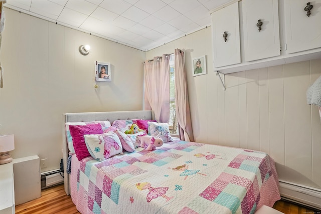17 Pleasant St, Danbury, CT 06810 - bedroom with a baseboard radiator, a baseboard heating unit, and wood finished floors