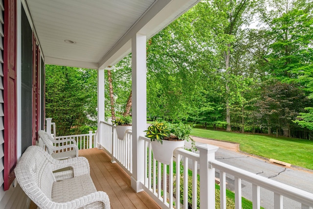 7 Concord Ct Unit 7, Southbury, CT 06488 - wooden porch with a lawn and view of scattered trees