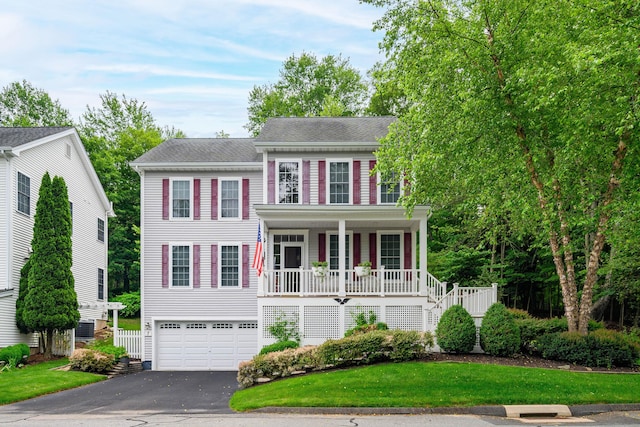 7 Concord Ct Unit 7, Southbury, CT 06488 - view of front of house with covered porch, stairway, an attached garage, asphalt driveway, and a front yard