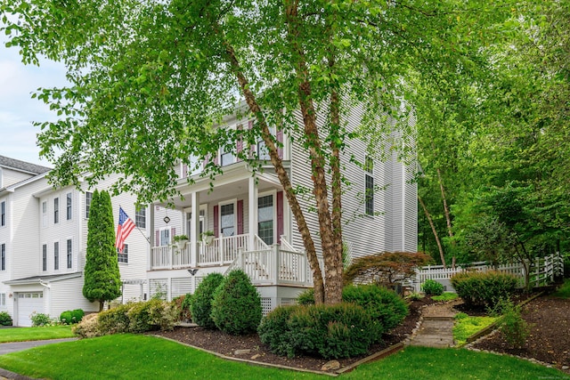 7 Concord Ct Unit 7, Southbury, CT 06488 - view of front of property featuring covered porch, a front yard, and an attached garage