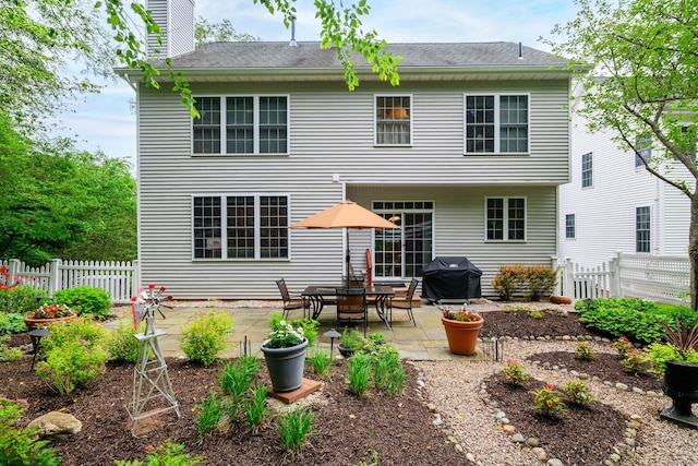 7 Concord Ct Unit 7, Southbury, CT 06488 - back of property with a patio area and a chimney
