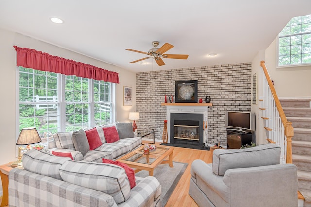 7 Concord Ct Unit 7, Southbury, CT 06488 - living room with wood finished floors, ceiling fan, stairs, a brick fireplace, and recessed lighting