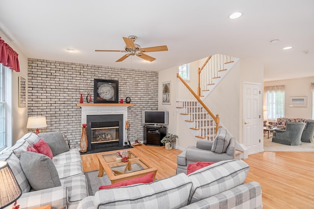7 Concord Ct Unit 7, Southbury, CT 06488 - living area featuring stairway, ceiling fan, wood finished floors, a brick fireplace, and recessed lighting