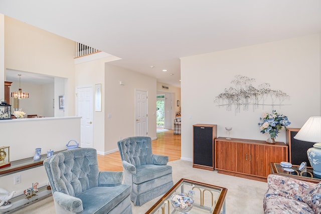 7 Concord Ct Unit 7, Southbury, CT 06488 - living area with a chandelier, recessed lighting, light carpet, and light wood-style flooring