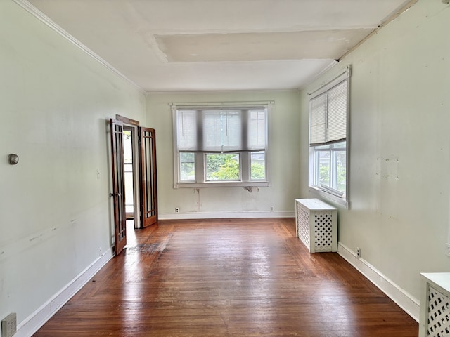 154 Golden St, Norwich, CT 06360 - spare room featuring radiator, hardwood / wood-style floors, and ornamental molding