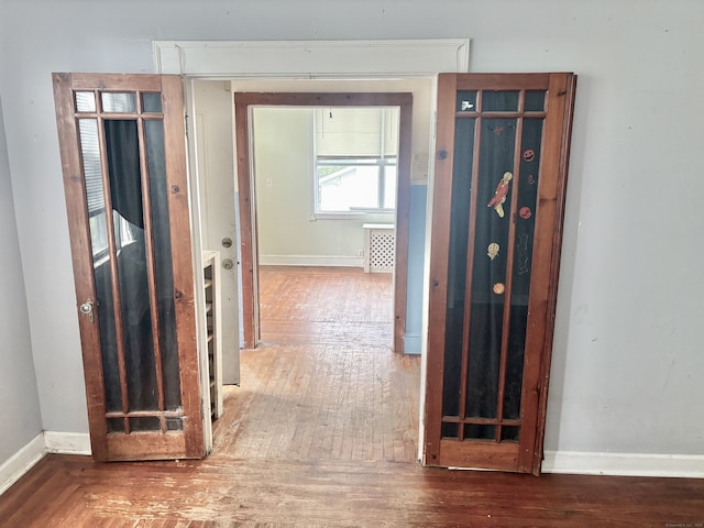 154 Golden St, Norwich, CT 06360 - hallway featuring baseboards and wood finished floors