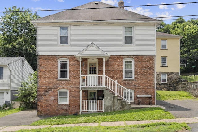 53 Norton St, Bristol, CT 06010 - view of front of house with brick siding and roof with shingles