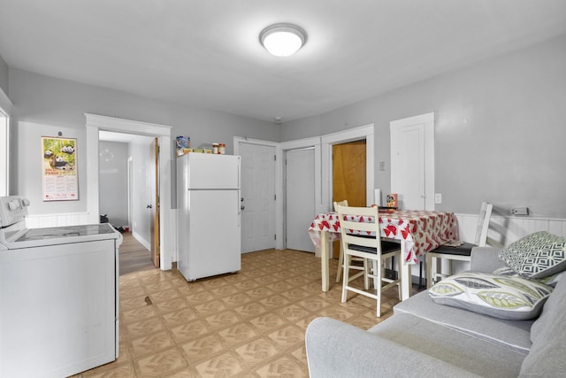 53 Norton St, Bristol, CT 06010 - kitchen featuring white appliances, light flooring, and washer / dryer