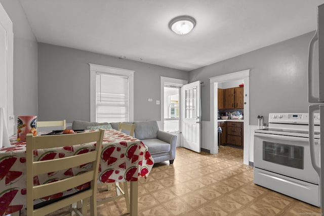 53 Norton St, Bristol, CT 06010 - kitchen with white electric stove, light countertops, and light floors