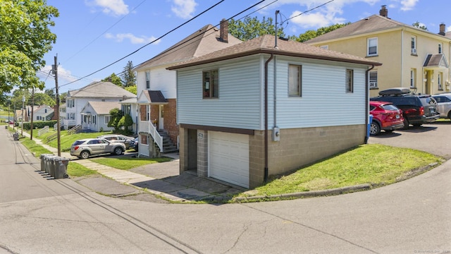 53 Norton St, Bristol, CT 06010 - view of front of house with a chimney, an attached garage, and a residential view