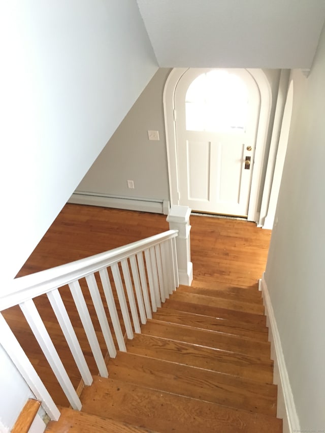1333 Blue Hills Ave, Bloomfield, CT 06002 - stairway with wood-type flooring, a baseboard radiator, and vaulted ceiling