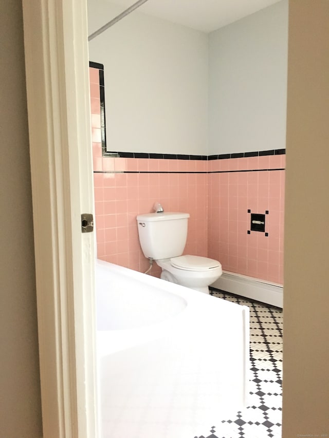 1333 Blue Hills Ave, Bloomfield, CT 06002 - bathroom featuring a baseboard radiator, tile walls, and wainscoting
