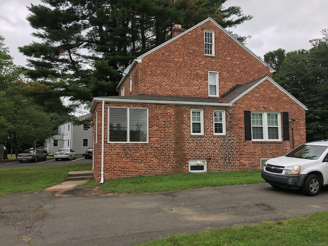1333 Blue Hills Ave, Bloomfield, CT 06002 - view of side of property featuring a chimney and brick siding