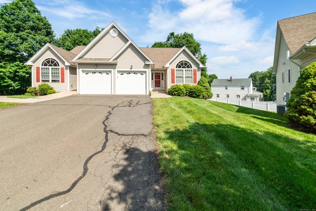 44 Forshaw Ave Unit 44, Plainville, CT 06062 - view of front of house with driveway, an attached garage, and a shingled roof