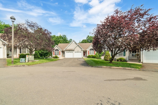 44 Forshaw Ave Unit 44, Plainville, CT 06062 - view of front facade with an attached garage, driveway, and a front lawn
