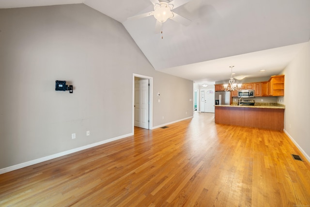 44 Forshaw Ave Unit 44, Plainville, CT 06062 - unfurnished living room with a chandelier, ceiling fan, high vaulted ceiling, and light wood-type flooring