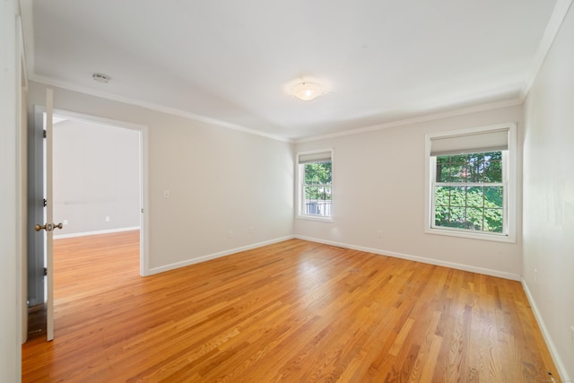 44 Forshaw Ave Unit 44, Plainville, CT 06062 - empty room with light wood finished floors, ornamental molding, and a smoke detector