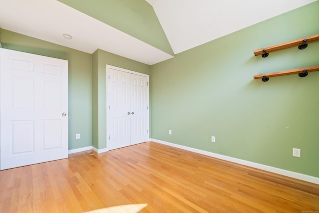 44 Forshaw Ave Unit 44, Plainville, CT 06062 - unfurnished bedroom with lofted ceiling, light wood-style flooring, and a closet