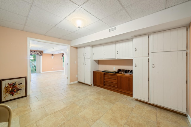 44 Forshaw Ave Unit 44, Plainville, CT 06062 - kitchen featuring a paneled ceiling and white cabinets