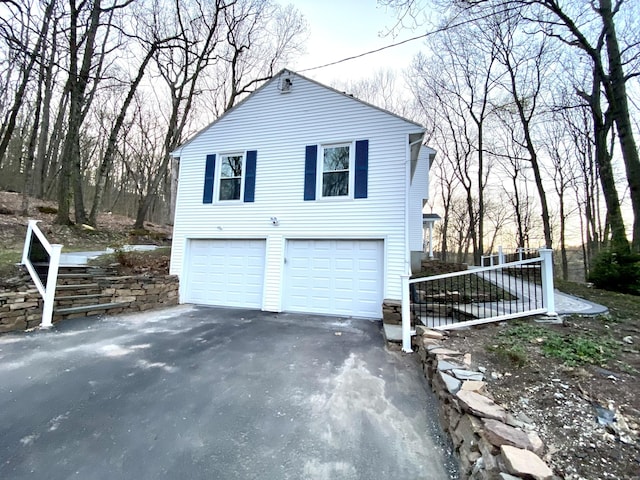 545 Simsbury Rd, Bloomfield, CT 06002 - view of home's exterior featuring driveway and a garage