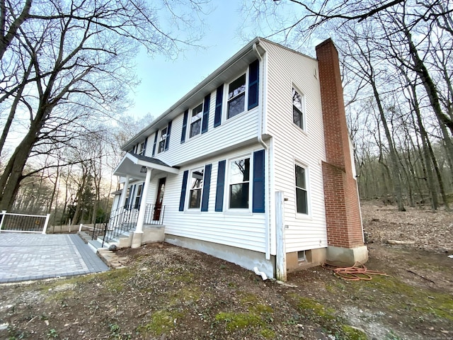 545 Simsbury Rd, Bloomfield, CT 06002 - view of side of home with a chimney