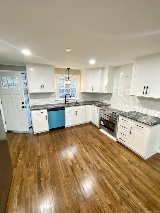 545 Simsbury Rd, Bloomfield, CT 06002 - kitchen featuring dishwashing machine, dark wood-style floors, tasteful backsplash, dark countertops, and white cabinetry