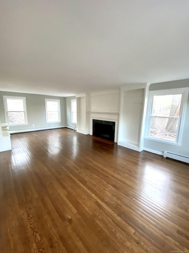 545 Simsbury Rd, Bloomfield, CT 06002 - unfurnished living room with dark wood-style floors, a baseboard heating unit, and a fireplace