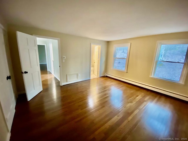 545 Simsbury Rd, Bloomfield, CT 06002 - spare room featuring baseboard heating and wood finished floors