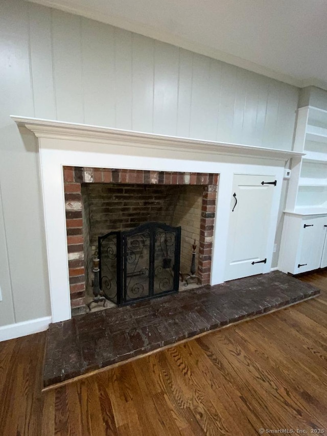 545 Simsbury Rd, Bloomfield, CT 06002 - detailed view of a brick fireplace and wood finished floors