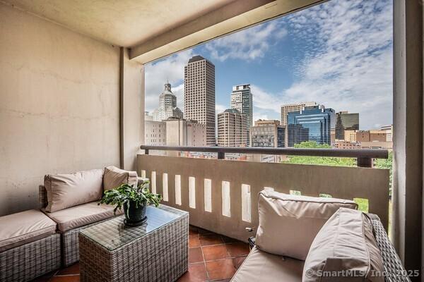 1 Gold St Apt 14A, Hartford, CT 06103 - balcony featuring a view of skyline and an outdoor hangout area