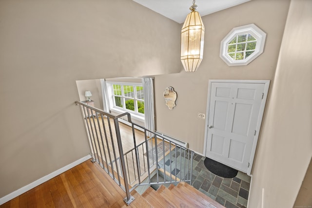 1519 Tuttle Ave, Wallingford, CT 06492 - entrance foyer with wood finished floors and a baseboard heating unit