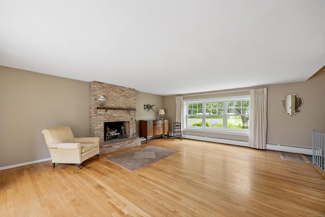 1519 Tuttle Ave, Wallingford, CT 06492 - unfurnished living room with wood finished floors, a fireplace, and a baseboard heating unit